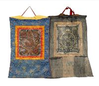 TWO TIBETAN MANDALA THANGKAS, 20th Century, one in dark hues, the other in bright colours, both with