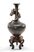 JAPANESE BRONZE DRAGON VASE, Meiji Period, of onion form, cast with a dragon emerging from waves