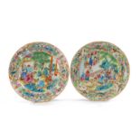 FINE PAIR CANTON FAMILLE ROSE DISHES, Daoguang, centres fully decorated with family groups and