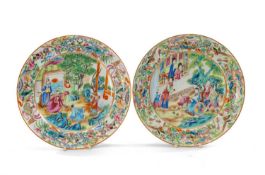 FINE PAIR CANTON FAMILLE ROSE DISHES, Daoguang, centres fully decorated with family groups and