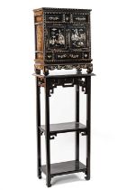 CHINESE BLACK LACQUER & MOTHER OF PEARL INLAID CABINET, c. 1900, fitted two panelled doors and apron