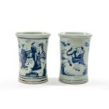 TWO CHINESE BLUE & WHITE BRUSHPOTS, 20th Century, painted with robed figures in a garden beneath