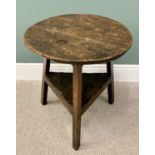 19TH CENTURY STAINED PINE CRICKET TABLE having a triangular lower shelf, 65cms H, 64cms Diameter.