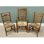 THREE RUSH SEATED LADDERBACK CHAIRS including one carver, on hoof supports, 114cms H, 60cms W, 43cms