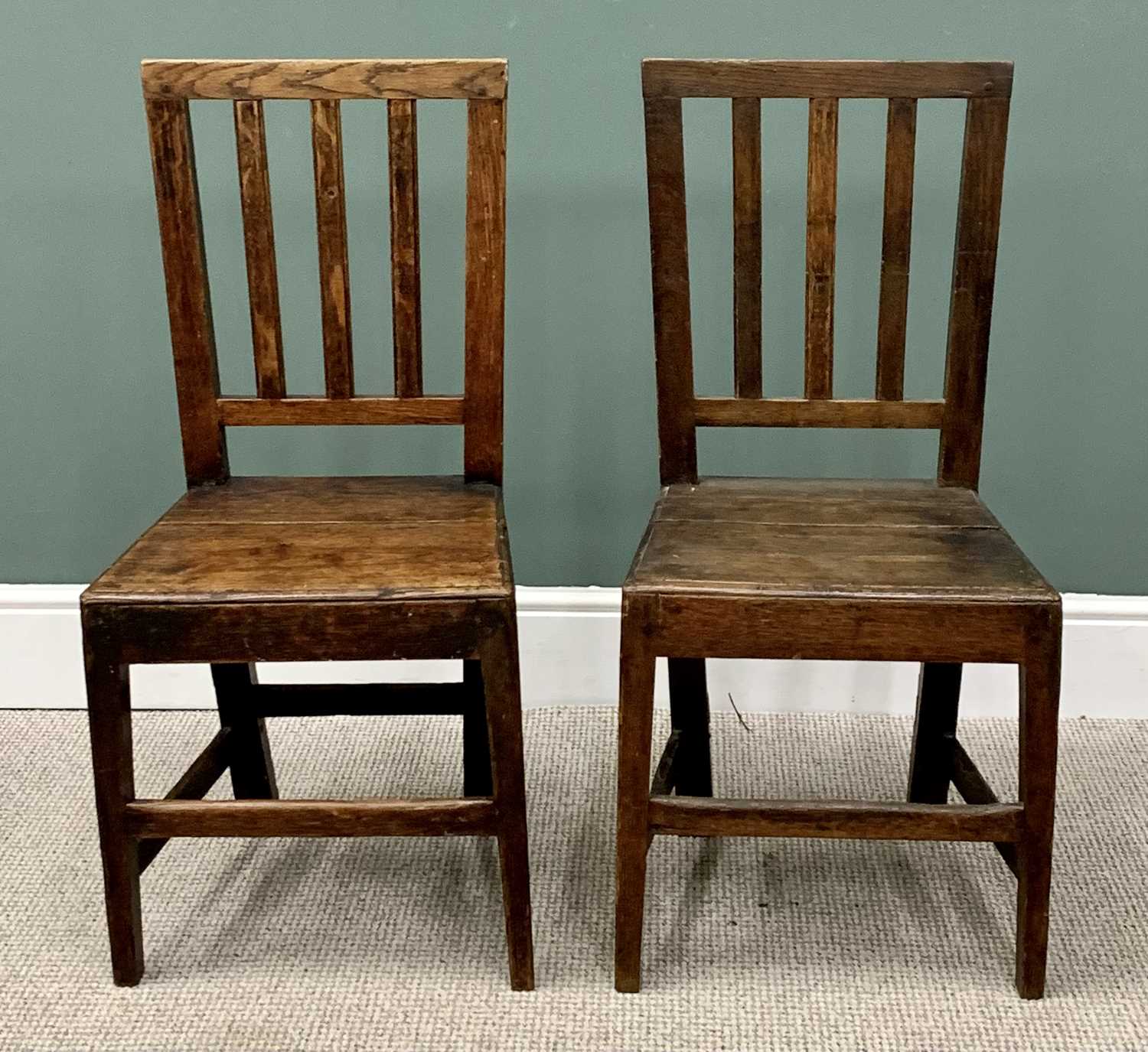 NEAR PAIR OF ANTIQUE OAK FARMHOUSE CHAIRS with slatted backs, 92cms H, 40cms W, 35cms D