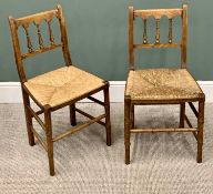 A PAIR OF ANTIQUE RUSH SEATED FARMHOUSE CHAIRS with spindle backs and arched crest rail, 84cms H,