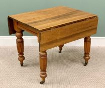 EDWARDIAN OAK TWIN FLAP TABLE on turned and reeded supports with metal castors, 73cms H, 114cms w (