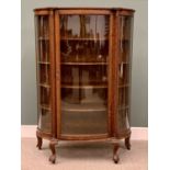 EDWARDIAN OAK DISPLAY CABINET having a bowfront single door and side panels on ball and claw feet,