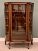 EDWARDIAN OAK DISPLAY CABINET having a bowfront single door and side panels on ball and claw feet,