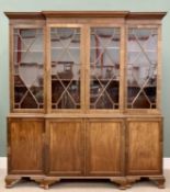 19th CENTURY MAHOGANY BREAKFRONT LIBRARY BOOKCASE CUPBOARD with a dentil cornice over four 13 x pane