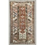 EASTERN WOOLLEN RUG with multicoloured and multibordered diamond and arrow pattern throughout, 192 x