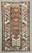 EASTERN WOOLLEN RUG with multicoloured and multibordered diamond and arrow pattern throughout, 192 x
