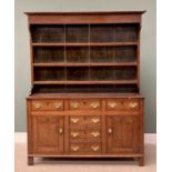 OAK WELSH DRESSER North Wales circa 1860, wide backboards to a three-shelf rack, the base with a T