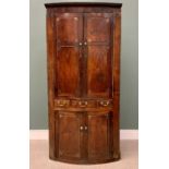 GEORGIAN OAK & MAHOGANY ONE PIECE STANDING CORNER CUPBOARD with bow front upper and lower panelled