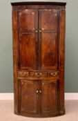 GEORGIAN OAK & MAHOGANY ONE PIECE STANDING CORNER CUPBOARD with bow front upper and lower panelled