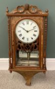 AMERICAN WALL CLOCK having a walnut case with bobbin pillars and carved crest, bell strike movement,