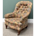 EDWARDIAN BUTTON BACK UPHOLSTERED TUB ARMCHAIR in floral upholstery, on turned front supports and