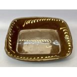 SLIPWARE RECTANGULAR DISH, PROBABLY BUCKLEY, 19th Century, brown glazed earthenware with trailed