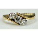 VINTAGE 18CT GOLD THREE-STONE DIAMOND RING the round cut stones individually set to closed mounts,