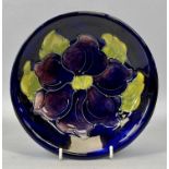 MOORCROFT 'ANEMONE' PATTERN CIRCULAR SHALLOW DISH, blue ground, impressed marks, 18.5cms diam.