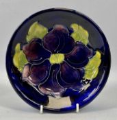 MOORCROFT 'ANEMONE' PATTERN CIRCULAR SHALLOW DISH, blue ground, impressed marks, 18.5cms diam.