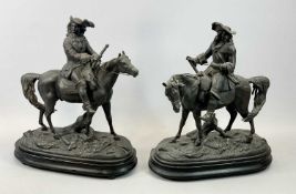 SPELTER FIGURES, A PAIR - late 19th Century, cavaliers on horseback, on oval wooden plinths, 39cms