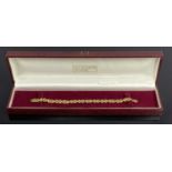 CONTINENTAL 9CT GOLD X-LINK BRACELET withl lobster clasp in an Elizabeth Duke box, 18cms L (open),