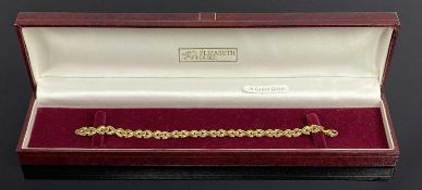 CONTINENTAL 9CT GOLD X-LINK BRACELET withl lobster clasp in an Elizabeth Duke box, 18cms L (open),