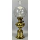 VICTORIAN BRASS OIL LAMP with British twin burners, clear globular glass shade, 58cms H overall