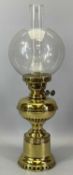 VICTORIAN BRASS OIL LAMP with British twin burners, clear globular glass shade, 58cms H overall