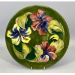 MOORCROFT 'HIBISCUS' PATTERN CIRCULAR SHALLOW DISH, green ground, with impressed marks, signed and