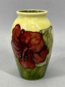 MOORCROFT 'HIBISCUS' PATTERN BALUSTER VASE, yellow / green ground with Queen Mary label, 11cms