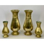 HEAVY BRASS ECCLESIASTICAL-STYLE BALUSTER VASES, A PAIR with red oxide bases, together with a