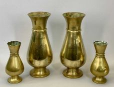 HEAVY BRASS ECCLESIASTICAL-STYLE BALUSTER VASES, A PAIR with red oxide bases, together with a