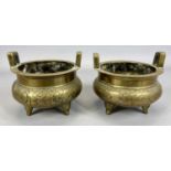 CHINESE BRONZE CENSERS, A PAIR, 19th Century, with side handles, engraved bodies, standing on