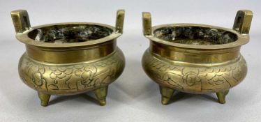 CHINESE BRONZE CENSERS, A PAIR, 19th Century, with side handles, engraved bodies, standing on