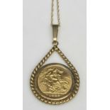 ELIZABETH II GOLD HALF SOVEREIGN 1982, in a 9ct pendant mount on a fine double link 9ct necklace,