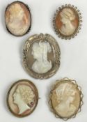 FIVE VINTAGE SHELL CARVED & OTHER CAMEO BROOCHES the largest showing a Greek type goddess holding