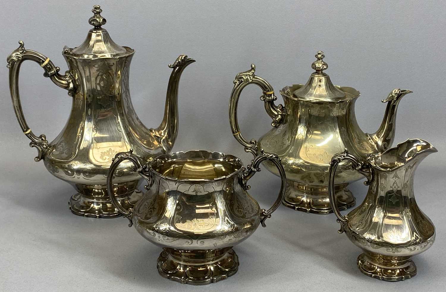 VICTORIAN SILVER PLATED FOUR-PIECE TEA & COFFEE SERVICE, squat form bodies, having Gothic-type