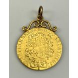 GEORGE II GOLD SPADE GUINEA, 1759, scroll mounted to the top with jump ring, the coin 25mm diam.,