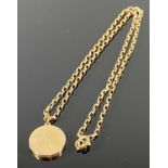 10CT GOLD CIRCULAR LOCKET ON A BELCHER LINK 9CT GOLD NECKLACE, the locket having engine turned