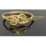 CHESTER 1907 9CT GOLD HOLLOW CORE BANGLE by Joseph Hawkins, the top having an openwork design of two