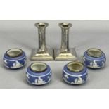 LOADED SILVER CANDLESTICKS, A SMALL PAIR & FOUR SILVER RIMMED JASPERWARE-TYPE POTTERY SALTS,