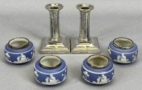 LOADED SILVER CANDLESTICKS, A SMALL PAIR & FOUR SILVER RIMMED JASPERWARE-TYPE POTTERY SALTS,