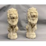 A PAIR OF RECONSTITUTED GARDEN STATUES modelled as seated lions, 50cms H