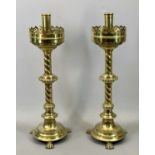 A PAIR OF VICTORIAN GOTHIC REVIVAL BRASS ALTAR CANDLESTICKS substantial & highly decorative with