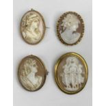 FOUR 9CT GOLD FRAMED SHELL CARVED CAMEO BROOCHES of oval format, the largest depicting the Three