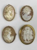 FOUR 9CT GOLD FRAMED SHELL CARVED CAMEO BROOCHES of oval format, the largest depicting the Three