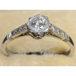 18CT WHITE GOLD SOLITAIRE DIAMOND RING coronet mounted, 0.33ct round brilliant set within a closed