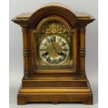 WALNUT CASED MANTEL CLOCK, early 20th Century, the case with dome top, arched door flanked by reeded